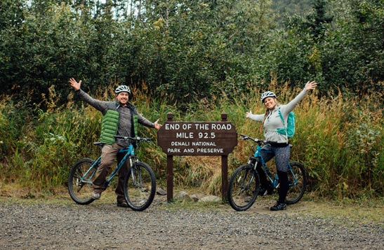 Two people on bicycles at the end of the Denali Park Road