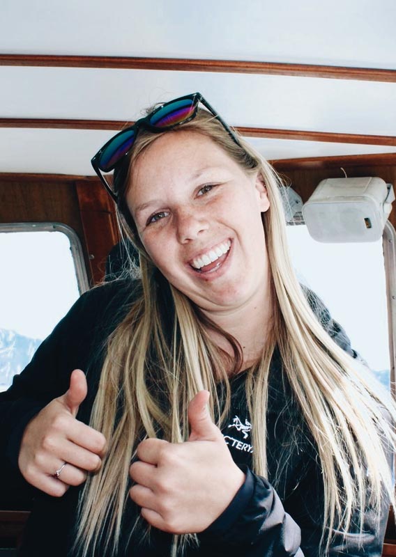 A Maligne Lake cruise interpreter gives the thumbs up