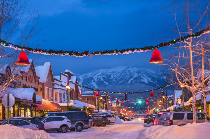 Christmas decorations and snow adorn Central Ave in Whitefish, MT
